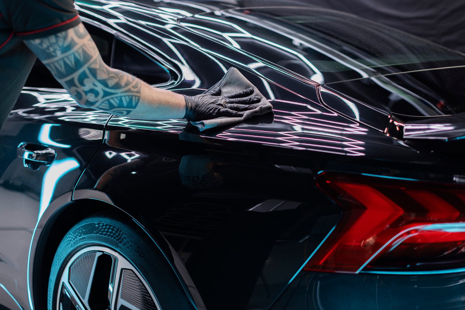 A detailer applying CeraFuse Ultra ceramic coating to a vehicle